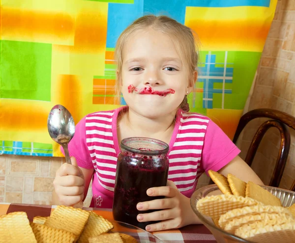 Little girl eating jam — Stock Photo, Image