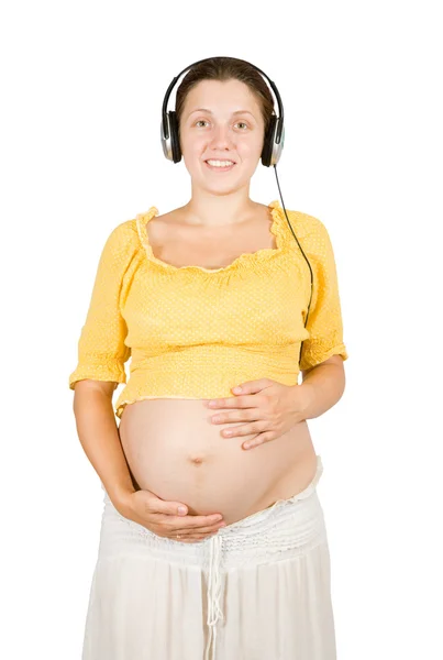 Mujer embarazada feliz escuchando música —  Fotos de Stock