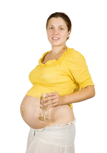 Těhotná dívka s vodním sklem — Stock fotografie