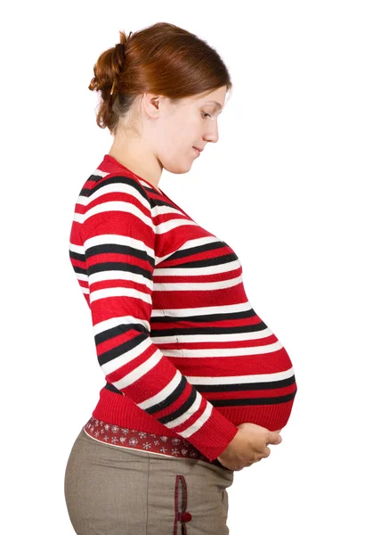 Mujer embarazada mirando vientre —  Fotos de Stock