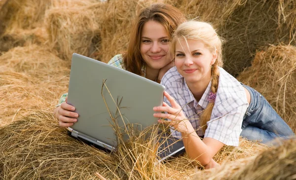 Country girls with notebook — Stock Photo, Image