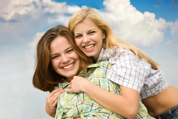 Girls together against sky — Stock Photo, Image