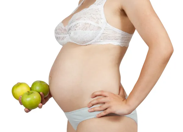 Gravid kvinna med äpplen — Stockfoto