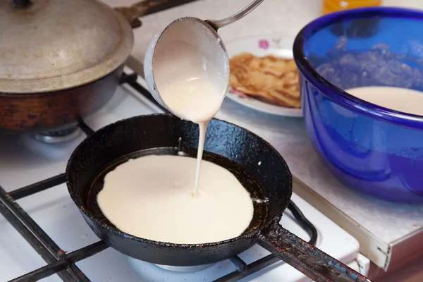Cooking pancake on griddle — Stock Photo, Image