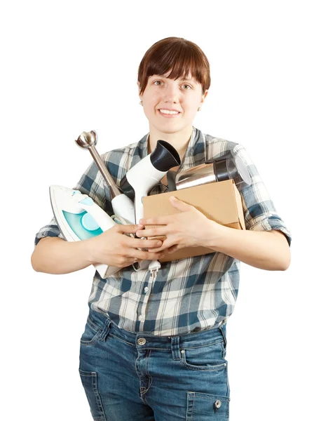Młoda kobieta z urządzeń gospodarstwa domowego — Zdjęcie stockowe