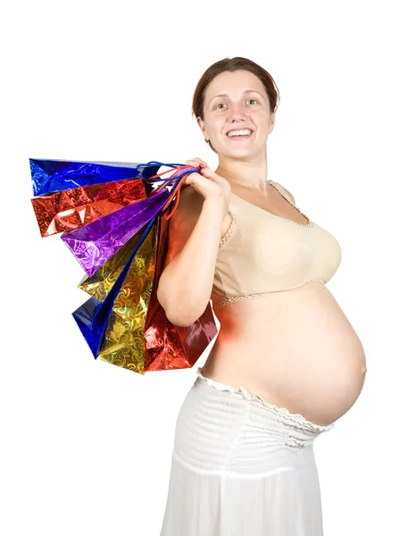 Hamile kadın ile alışveriş torbaları — Stok fotoğraf
