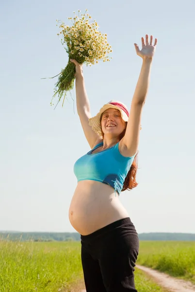 Pregnant woman in summer day Stock Image