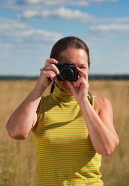 Senior woman taking photo clipart