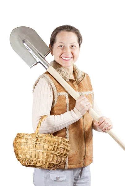 Happy woman with spade and basket — Stock Photo, Image