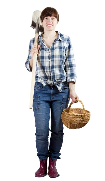 Happy woman with spade and basket — Stock Photo, Image