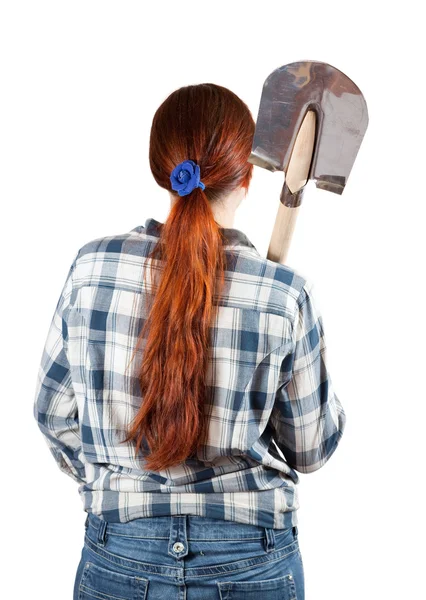 踏鋤を持つ女性の背面図 — ストック写真