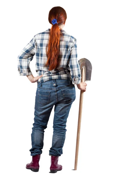 Вид ззаду на фермерку з лопатою — стокове фото