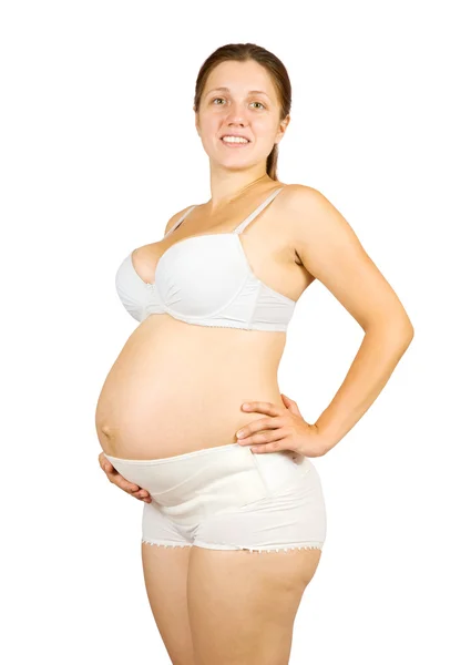 Kobieta w ciąży ubieranie ciała bel — Zdjęcie stockowe