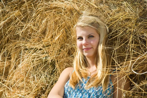 Girl on hay — Stock Photo, Image