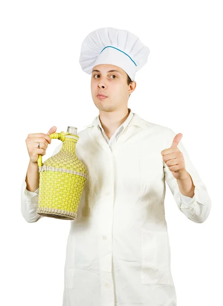 Cook man in toque with bottle — Stock Photo, Image