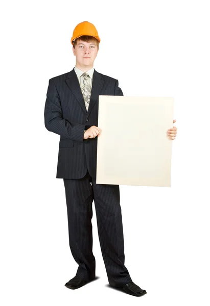 Бізнесмен в хардхаті тримає банер — стокове фото