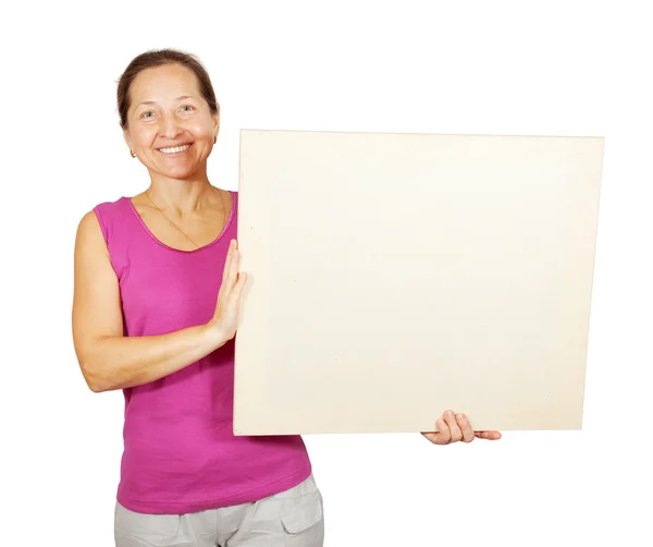 Mature woman holds blank placard — Stock Photo, Image