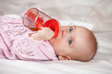 Baby girl with sippy cup clipart