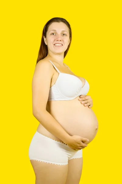 Woman holding pregnant belly — Stock Photo, Image
