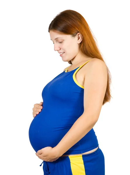 Gravid flicka håller hennes mage — Stockfoto