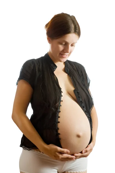 Feliz mulher grávida segurando barriga — Fotografia de Stock