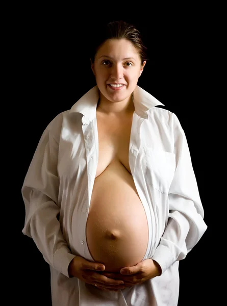 Terhes nő gazdaság has — Stock Fotó