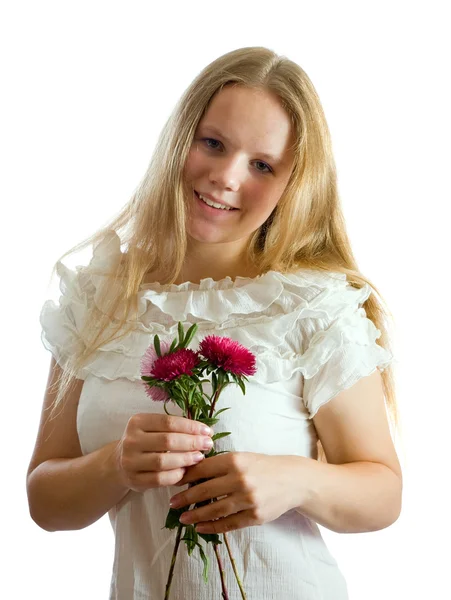 Hezká dívka s květinami — Stock fotografie