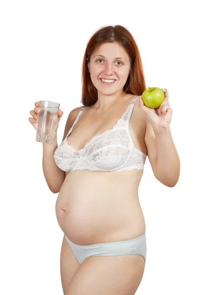 Έγκυος γυναίκα με νερό και μήλο — Φωτογραφία Αρχείου