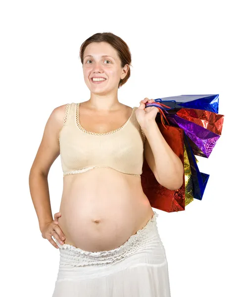 Mujer embarazada con bolsas de compras —  Fotos de Stock