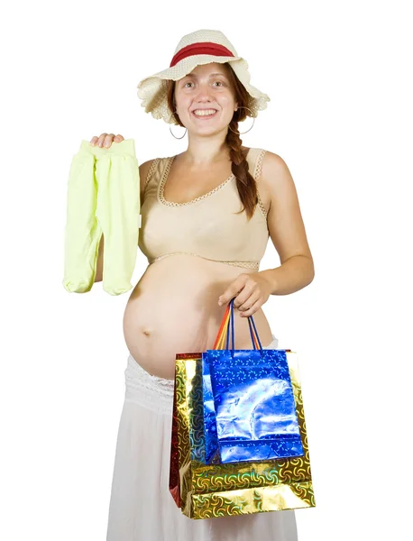 Mujer embarazada con ropa de bebé —  Fotos de Stock