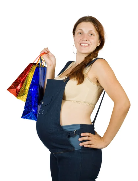 Ciężarna kobieta z torbami na zakupy — Zdjęcie stockowe