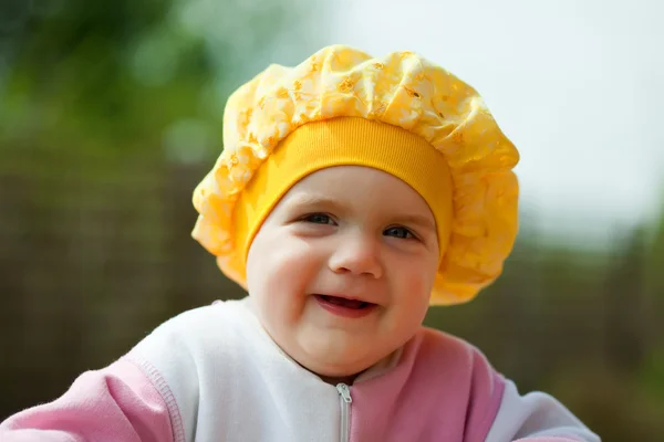 Happy baby girl against sunlight — Stock Photo, Image