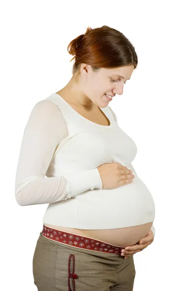 Heureuse femme enceinte tenant son ventre — Photo