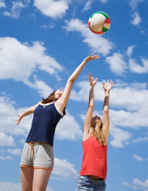 Girls playing volleyball clipart