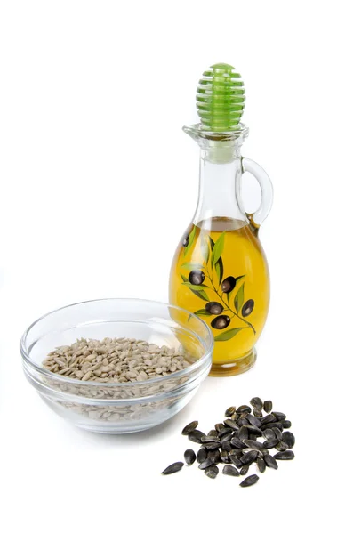 Oil and sunflower seeds — Stock Photo, Image