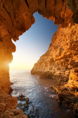 Sunset into grotto clipart