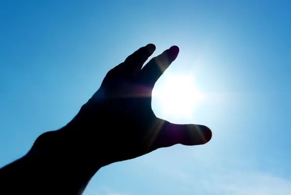 Hand aan zon — Stockfoto
