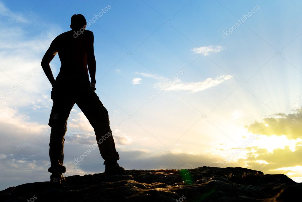 Silhouette of man in mountain.