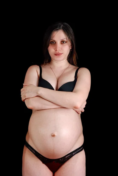 Mulher grávida em fundo preto — Fotografia de Stock
