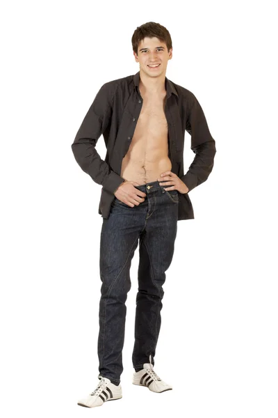 Young man in an unbuttoned shirt, full length — Stock Photo, Image