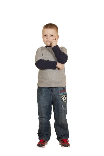 Chlapec stojí hlavou v ruce — Stock fotografie