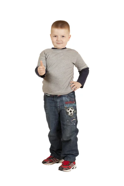 Boy to his full height with his hand raised — Stockfoto