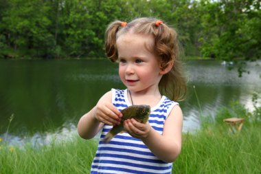 Fishing - littlle girl with catching fish clipart