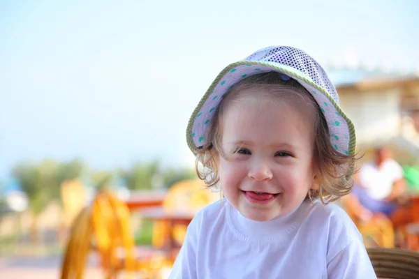Laughing little girl in hat — Stock Photo, Image