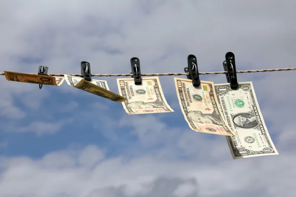 Paper dollars are drying on rope — Stock Photo, Image