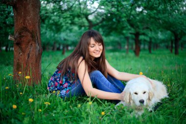 Girl and retriever in park clipart