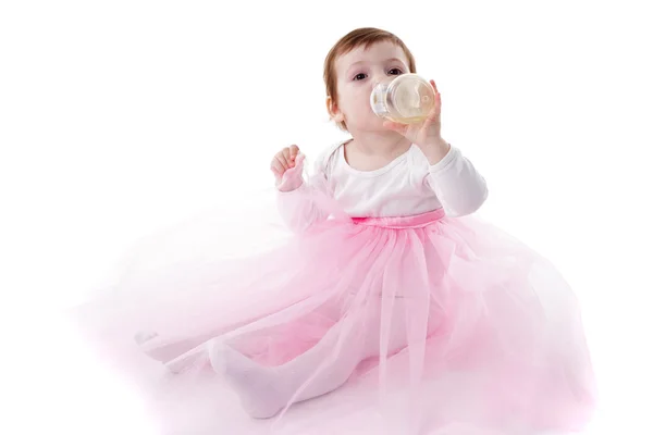 stock image Girl is drinking from bottle isolated