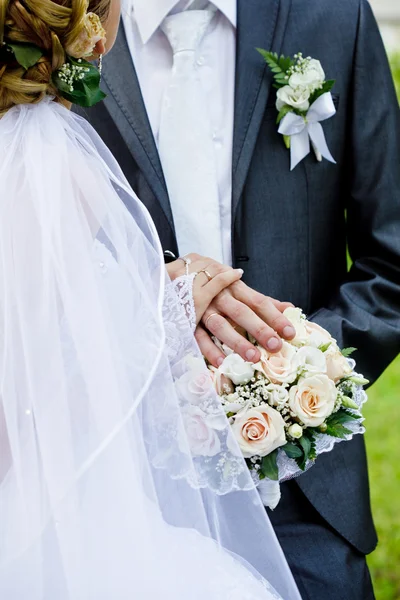 Wedding bouquet and groom — Stock Photo, Image