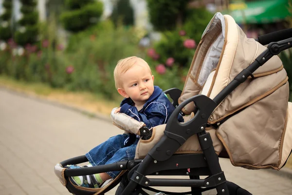 Toddler in baby carriage — Stock Photo, Image