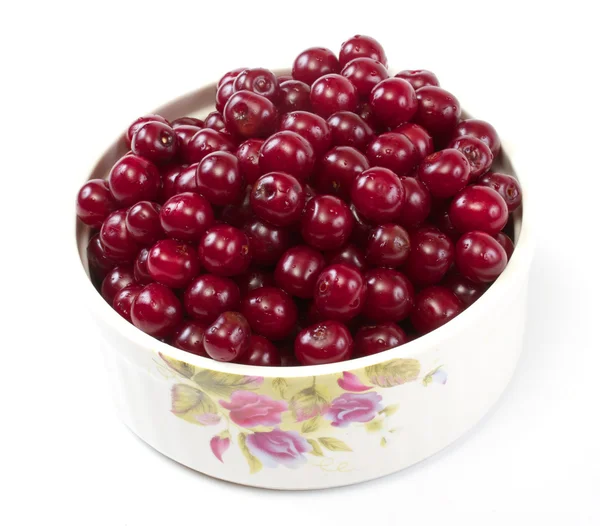 Stock image Bowl with ripe cherries. Isolated on a white background.